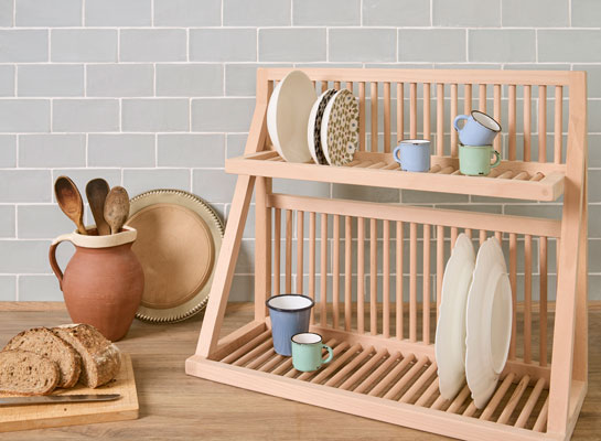 Our counter top plate rack being used to store plates and cups in the kitchen. Placed on the counter, the dish rack holds many item which can be accessed easily. 