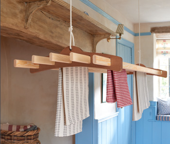 The Arthur clothes airer set in a woodland cottage style setting