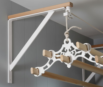 Ceiling clothes airer suspended from a wall bracket